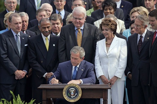 United States President George W. Bush signs amendments to the Voting Rights Act in July 2006.