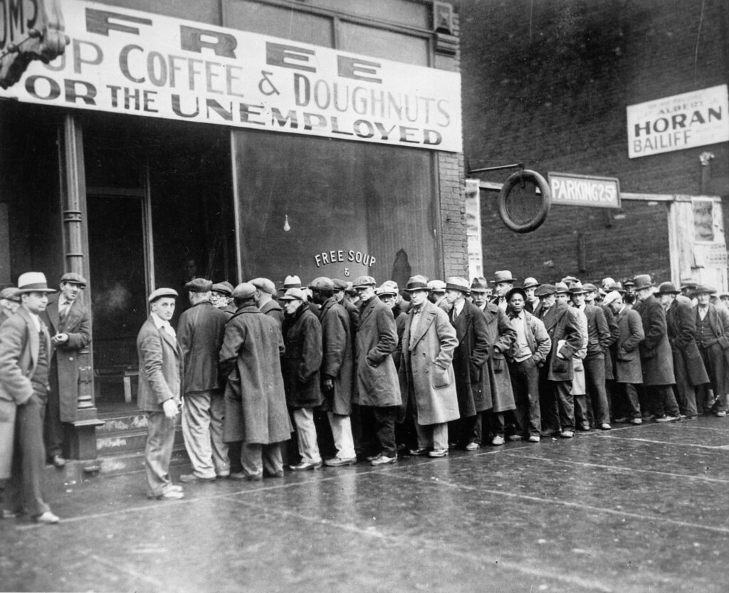 Overfinancialization of the economy. Finance industry. Unemployed people lined up outside a soup kitchen opened in Chicago by Al Capone, February 1931.